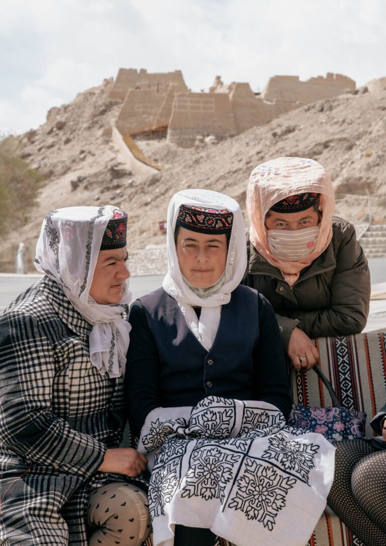 Three women in traditional attire.